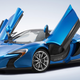 Illustration for article titled This Stealth Grey And Orange Bespoke McLaren P1 Is A Symphony Of Evil